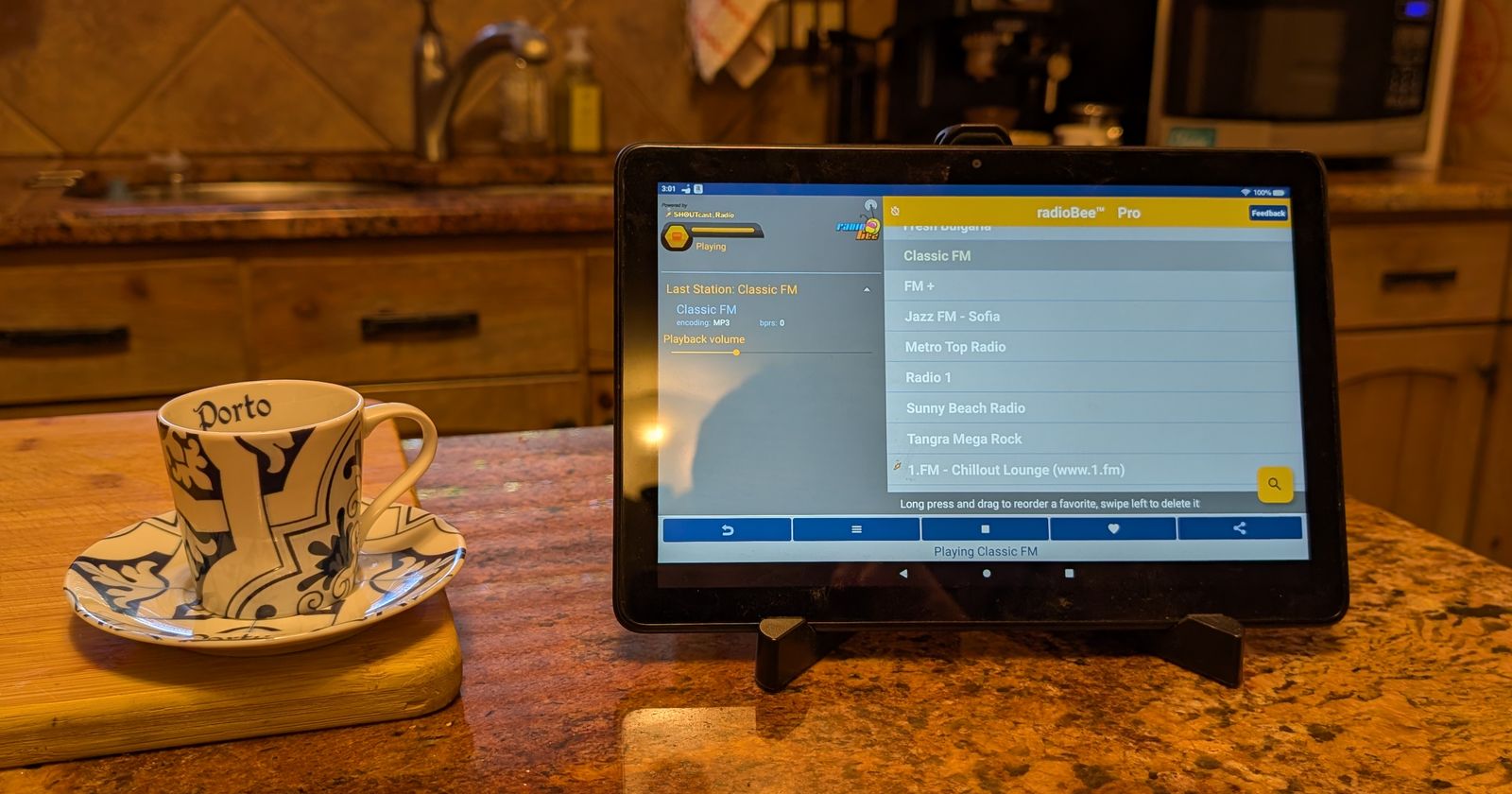 Old Fire tablet on a kitchen counter running radioBee internet radio